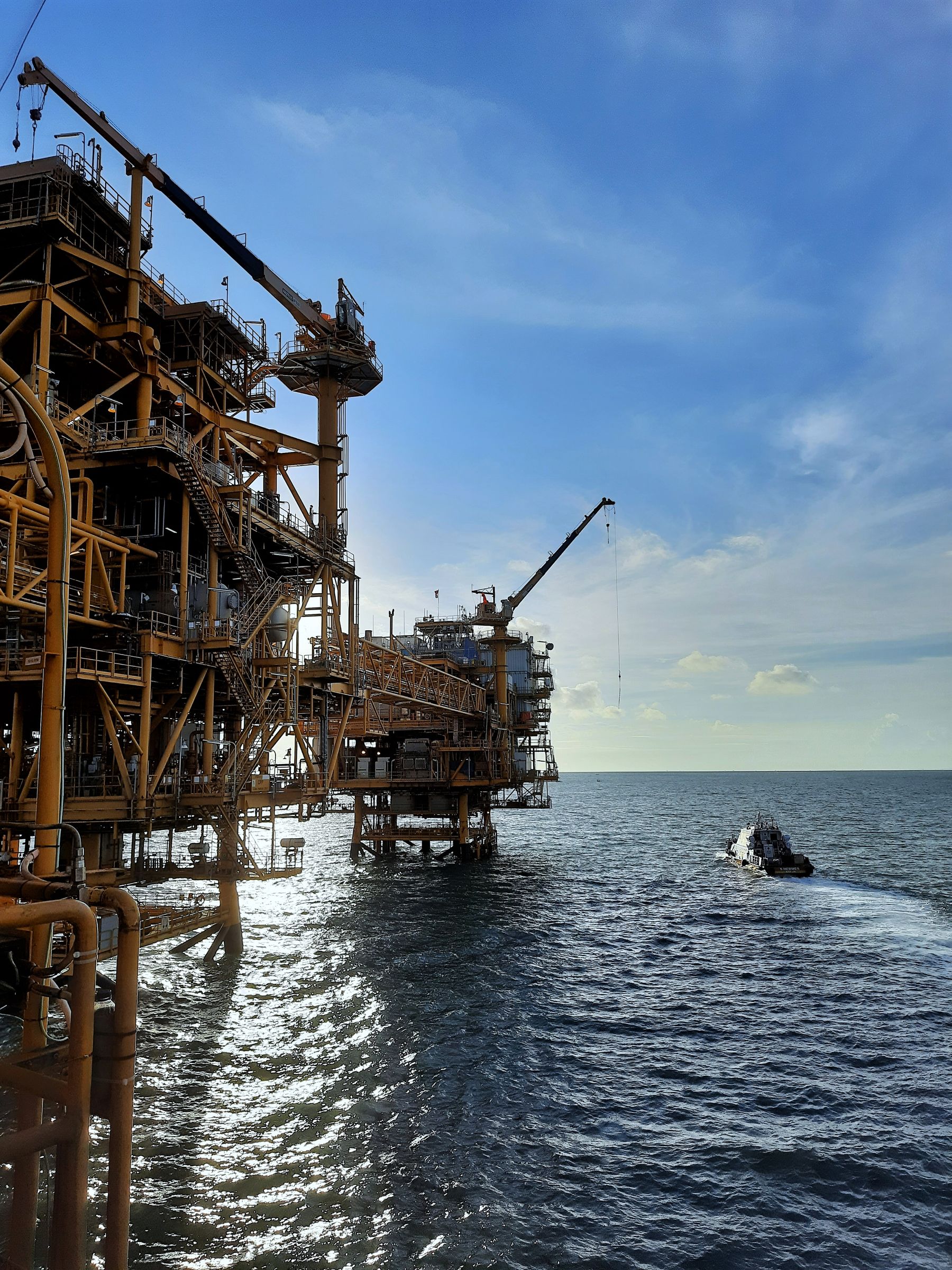 Support craft beside an offshore industrial platform