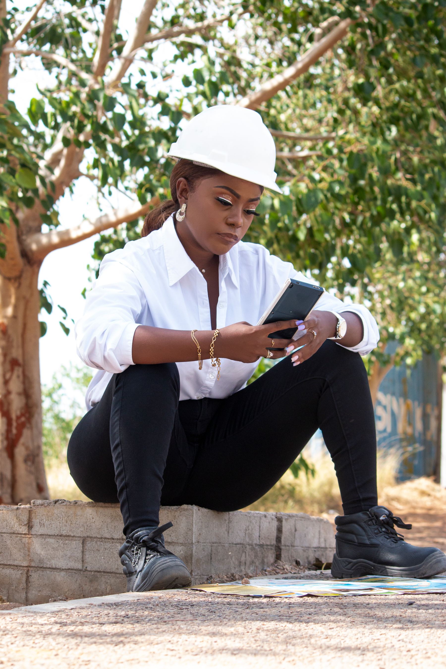 Field engineer in Angola reviewing information on a mobile device