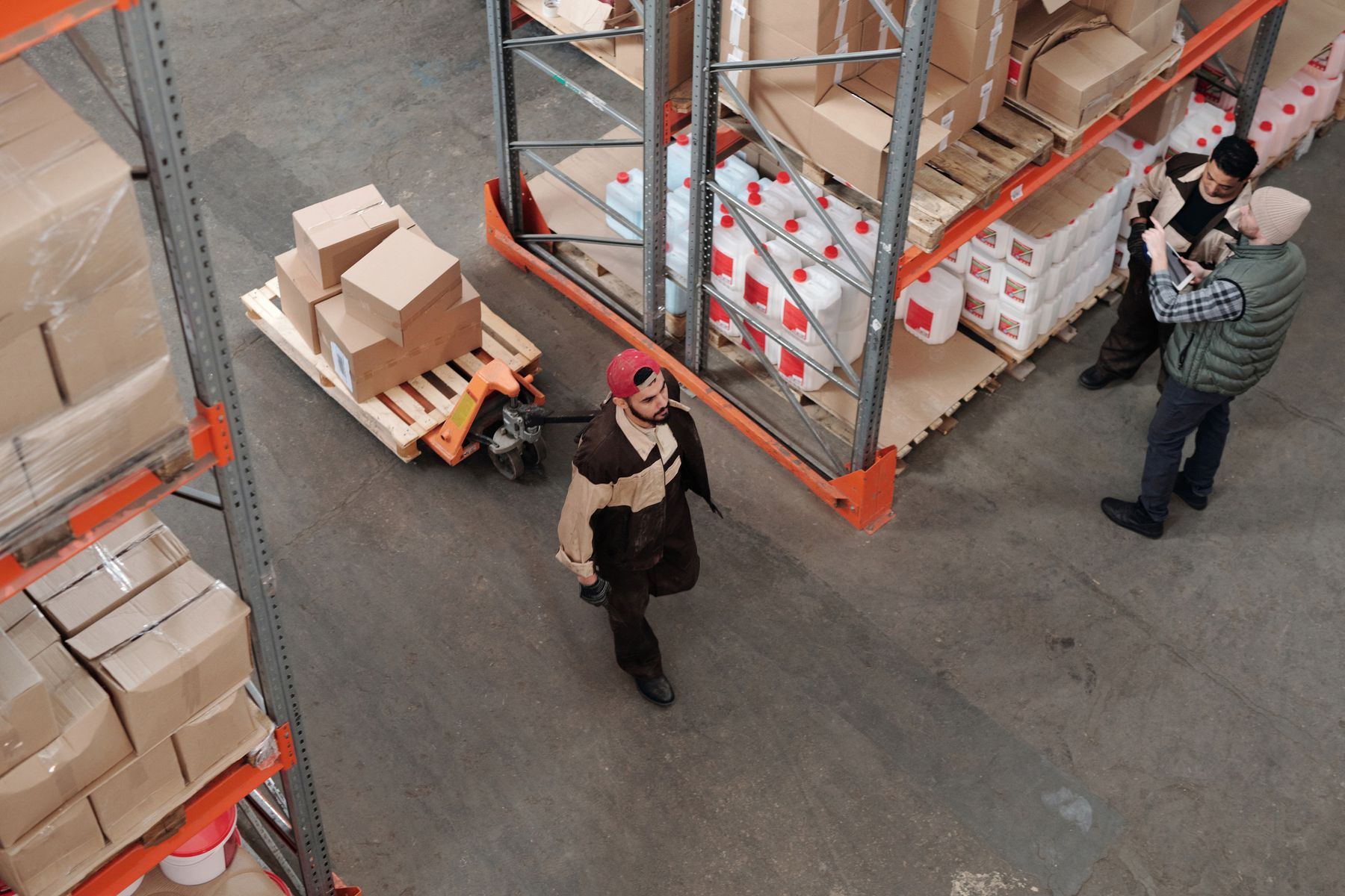 Warehouse team checking inventory and coordinating supplies
